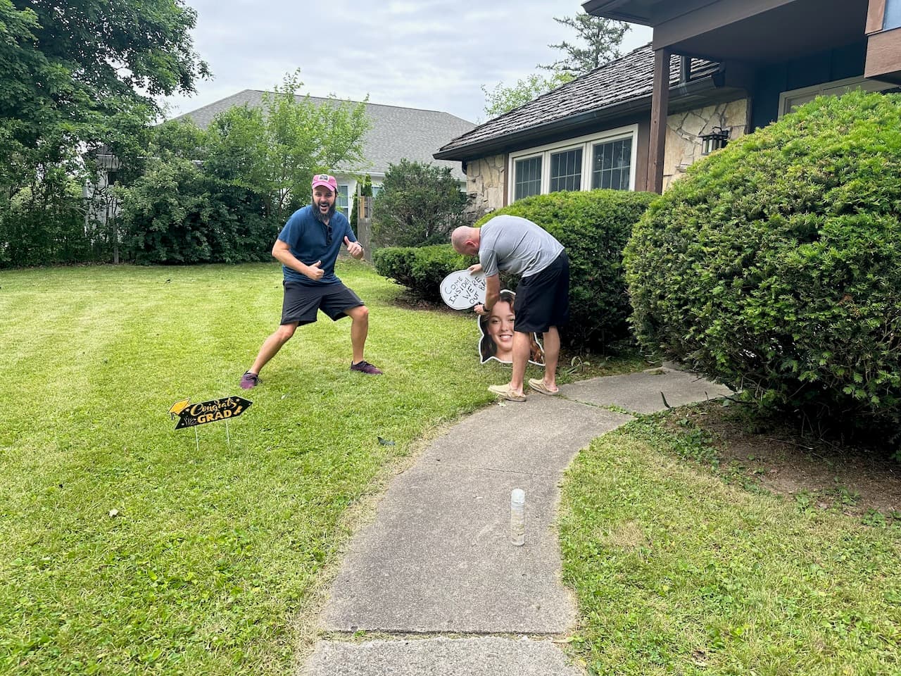 Shawn "helping" his brother, Jason, with the decor for her graduation party